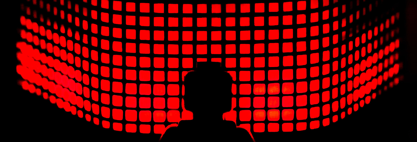abstract red square shapes and silhouette of a lego minifigure
